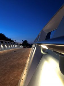 A bridge with lighting along the walkway.
