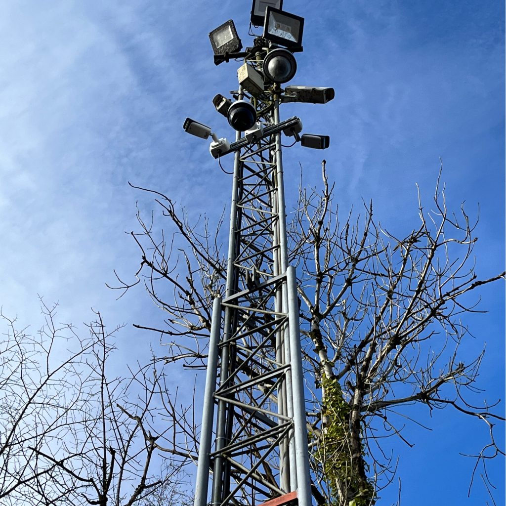 a lighting rig outside against a blue sky