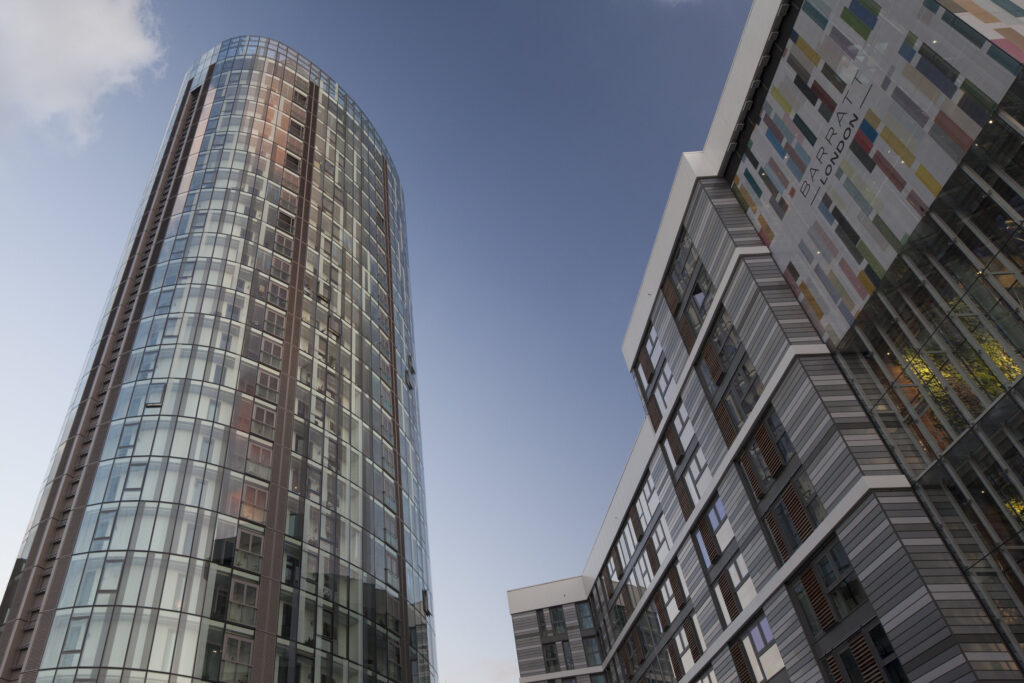 image of a tower block taken from the ground looking up with blue sky in the background.