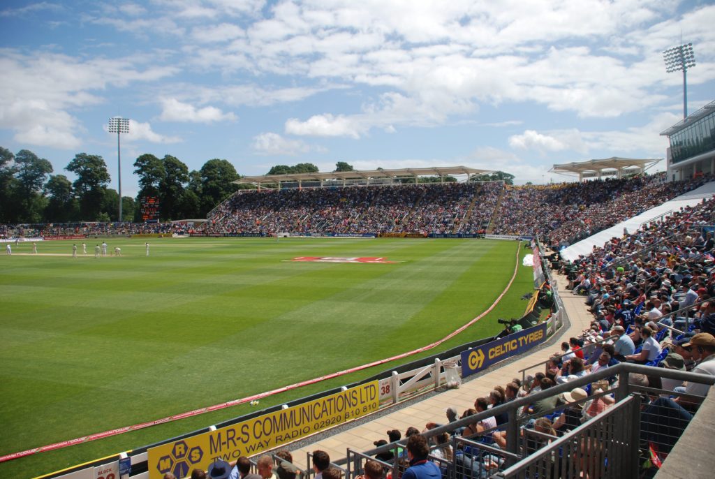 Interior of a cricket ground on match day with full stands
