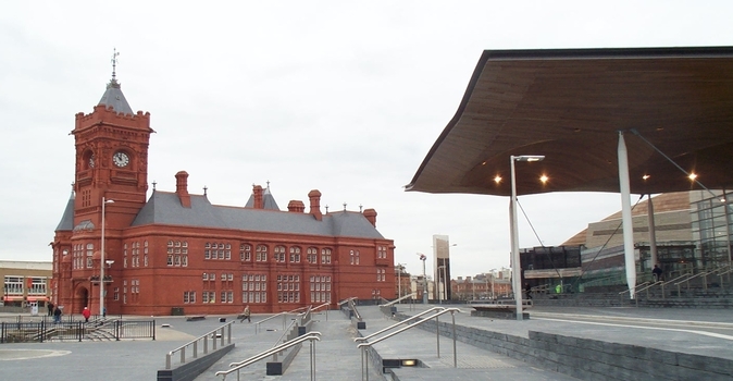 Exterior of the Pierhead Building in Cardiff, a red building with a clocktower and a grey roof